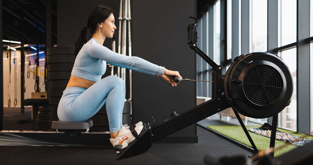 Woman doing exercise on rowing machine