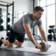 A men with ab roller and knee pads